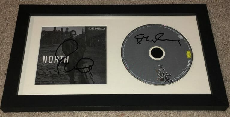 ELVIS COSTELLO TWICE 2X SIGNED AUTOGRAPH NORTH FRAMED CD & BOOKLET W/EXACT PROOF
 COLLECTIBLE MEMORABILIA