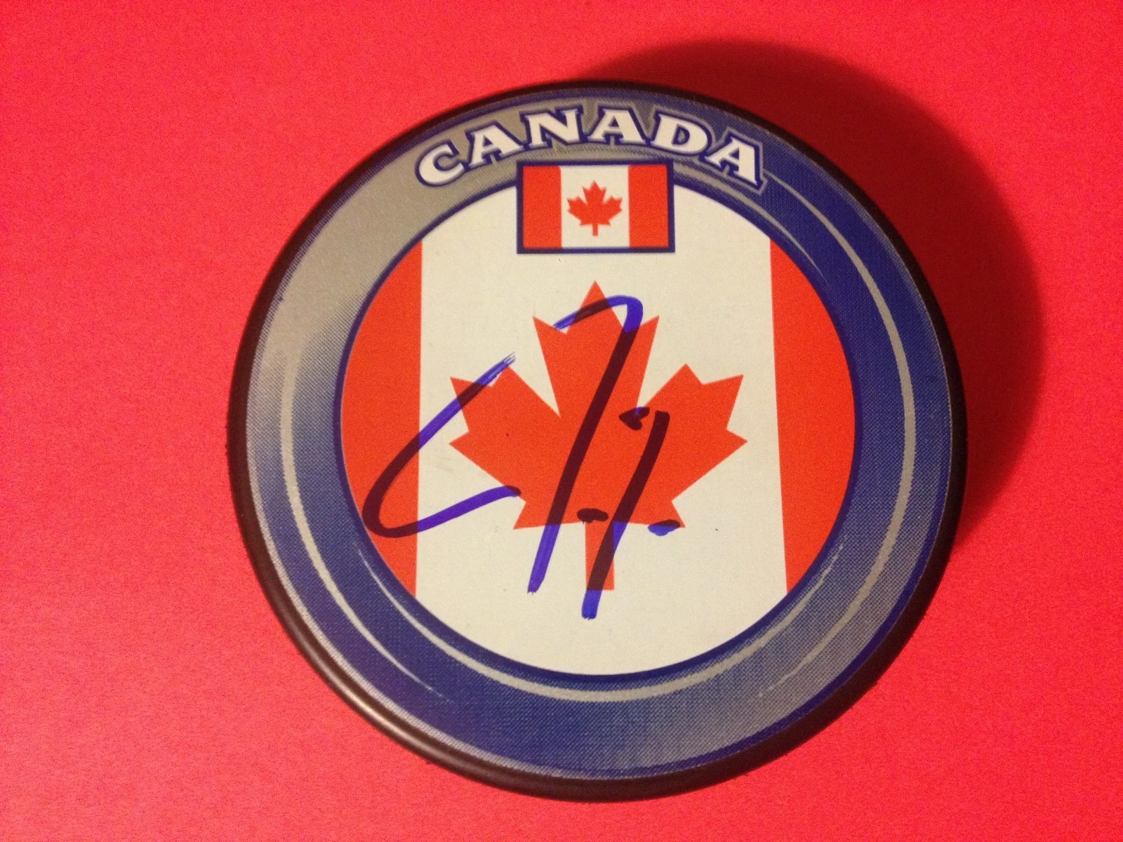 Jordan Eberle Oilers Team Canada Flag Signed Puck Auto
