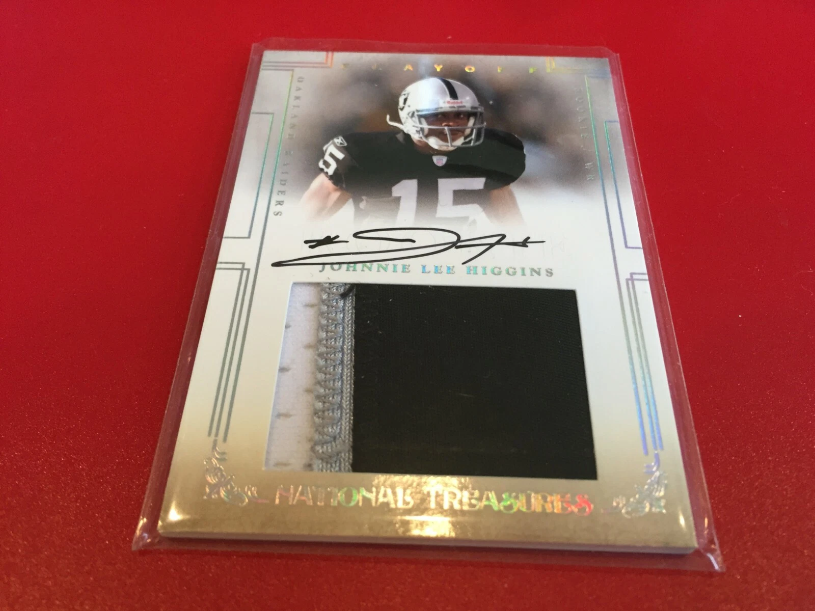 Johnnie Lee Higgins 2007 National Treasures Rookie 3-CLR Patch Jersey Auto /99
