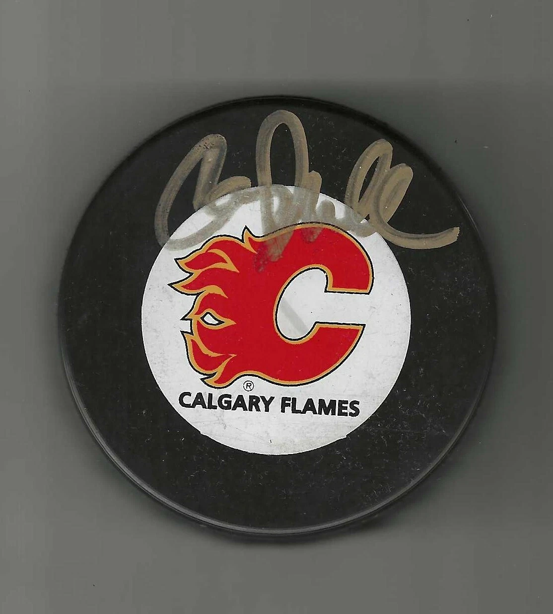 Corey Millen Signed Calgary Flames Trench Puck
