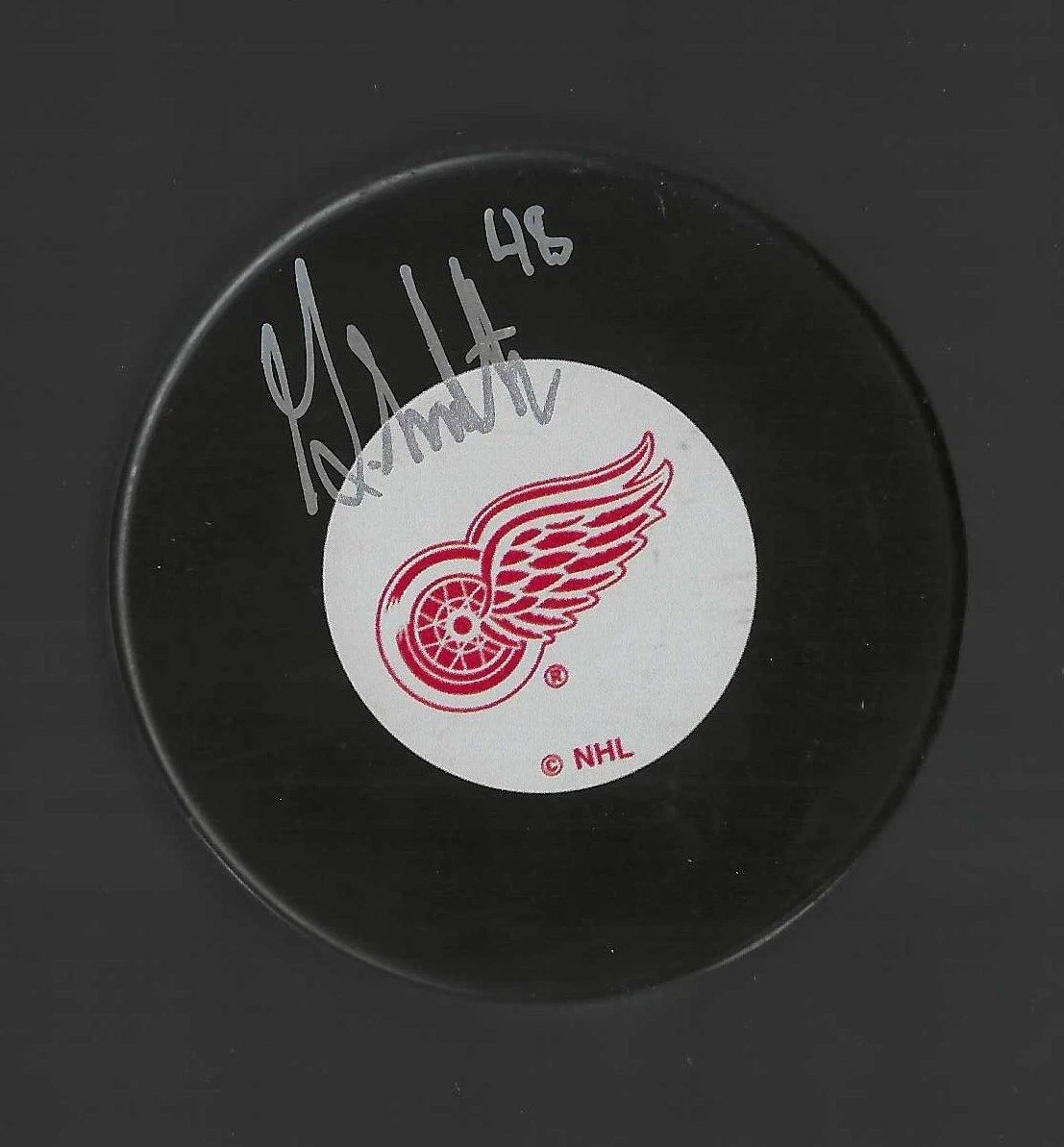 Givani Smith Signed Detroit Red Wings Puck

