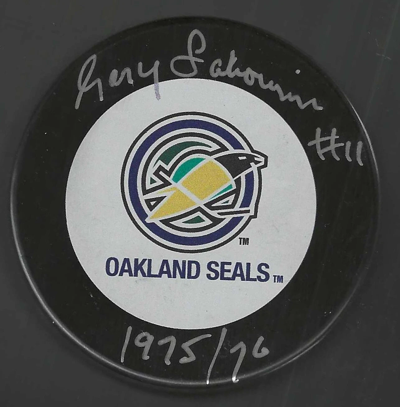 Gary Sabourin Signed & Inscribed Oakland Seals Puck
