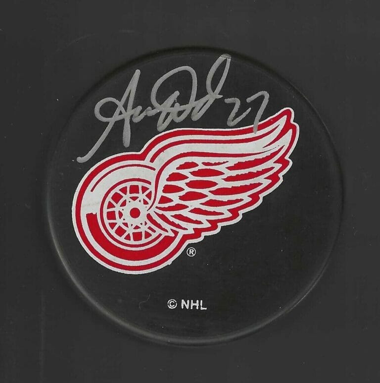 AARON WARD SIGNED DETROIT RED WINGS RAVENS ATHLETIC PUCK
 COLLECTIBLE MEMORABILIA