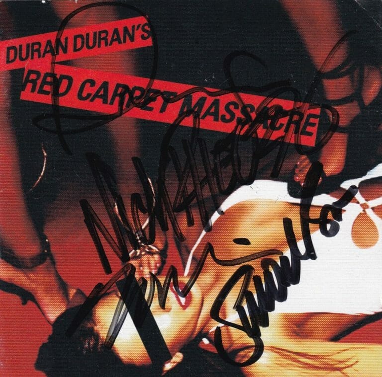 DURAN DURAN SIGNED (RED CARPET MASSACRE CD COVER AUTOGRAPHED BECKETT BAS AC93487
 COLLECTIBLE MEMORABILIA