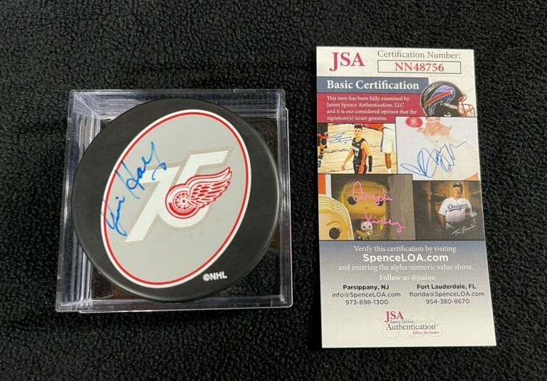 JIM “REDEYE” HAY SIGNED DETROIT RED WINGS 75TH ANNIVERSARY PUCK JSA COA
 COLLECTIBLE MEMORABILIA