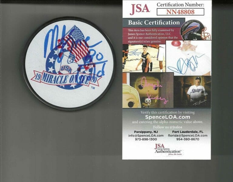 MIKE ERUZIONE SIGNED & INSCRIBED “1980 GOLD” MIRACLE ON ICE USA PUCK JSA COA
 COLLECTIBLE MEMORABILIA