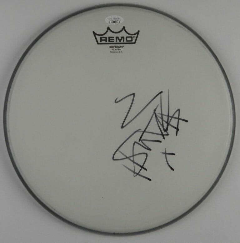 TRAVIS BAKER JSA AUTOGRAPH SIGNED DRUM HEAD COA 12″ BLINK 182
 COLLECTIBLE MEMORABILIA