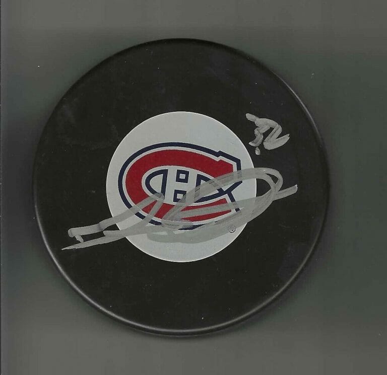 TRAVIS MOEN SIGNED MONTREAL CANADIENS PUCK
 COLLECTIBLE MEMORABILIA