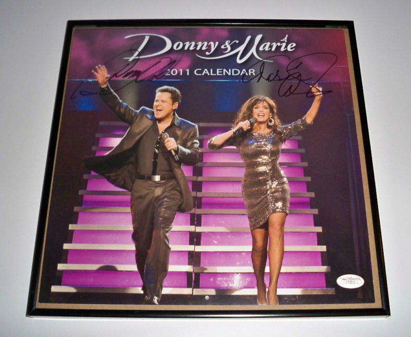 DONNY & MARIE OSMOND Signed FRAMED 2011 Calendar JSA!
