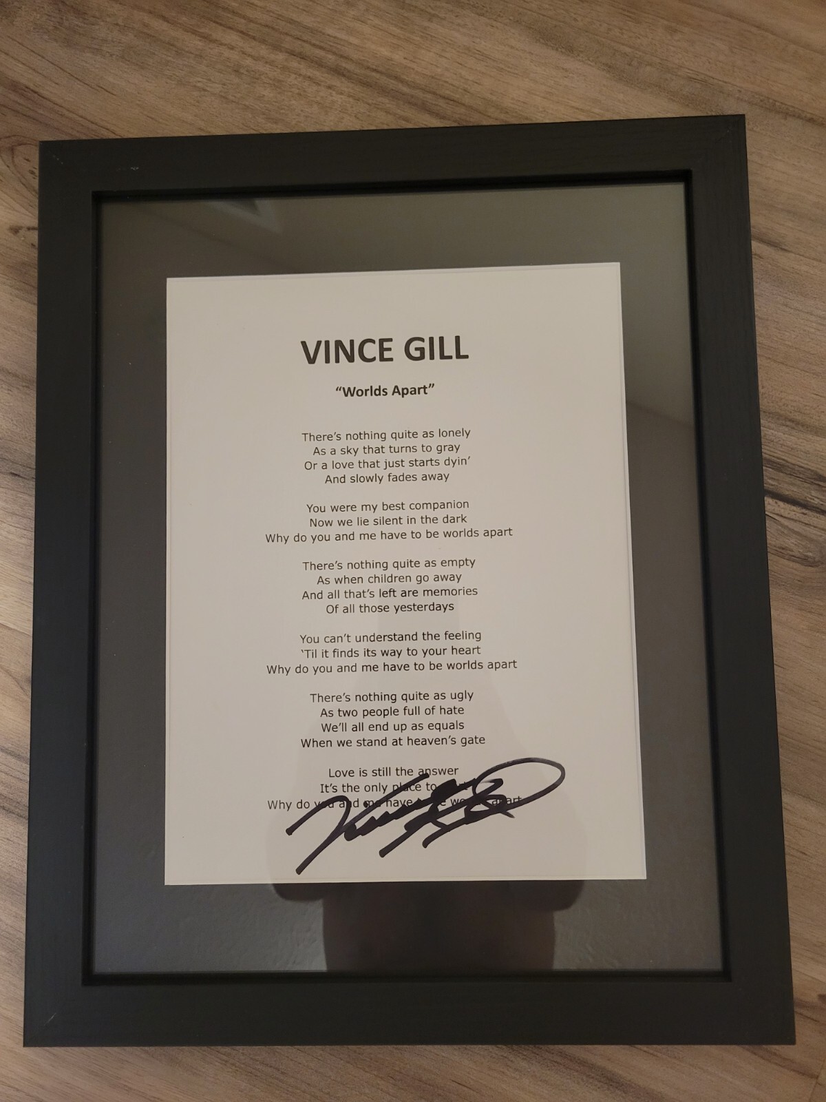 VINCE GILL SIGNED FRAMED WORLDS APART AUTOGRAPHED LYRIC SHEET COLLECTIBLE MEMORABILIA