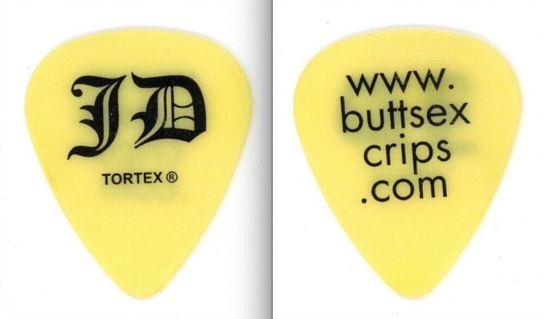 KORN JONATHAN DAVIS BUTTSEXCRIPS.COM YELLOW GUITAR PICK
 COLLECTIBLE MEMORABILIA