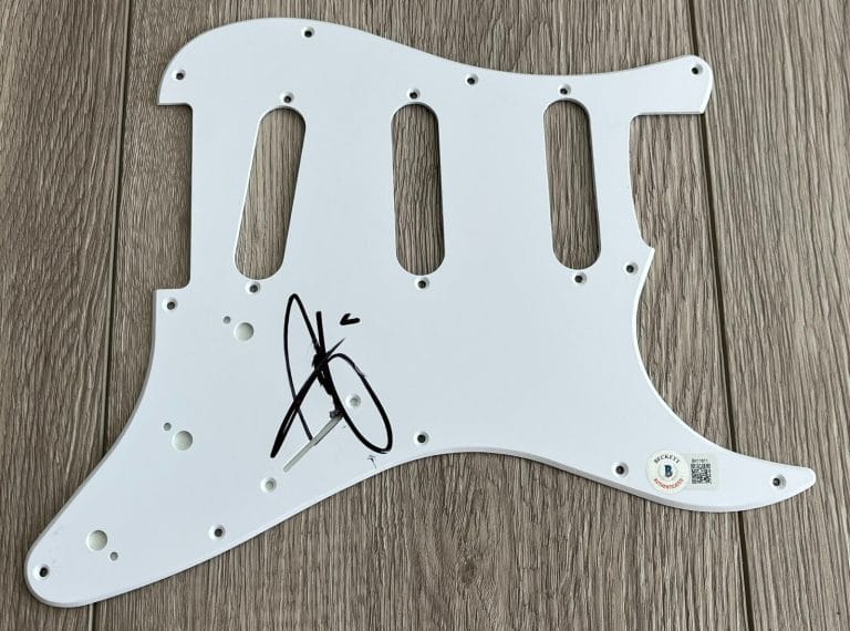 CHRISTINA AGUILERA SIGNED STRIPPED GUITAR PICKGUARD W/PROOF & BECKETT BAS COA COLLECTIBLE MEMORABILIA