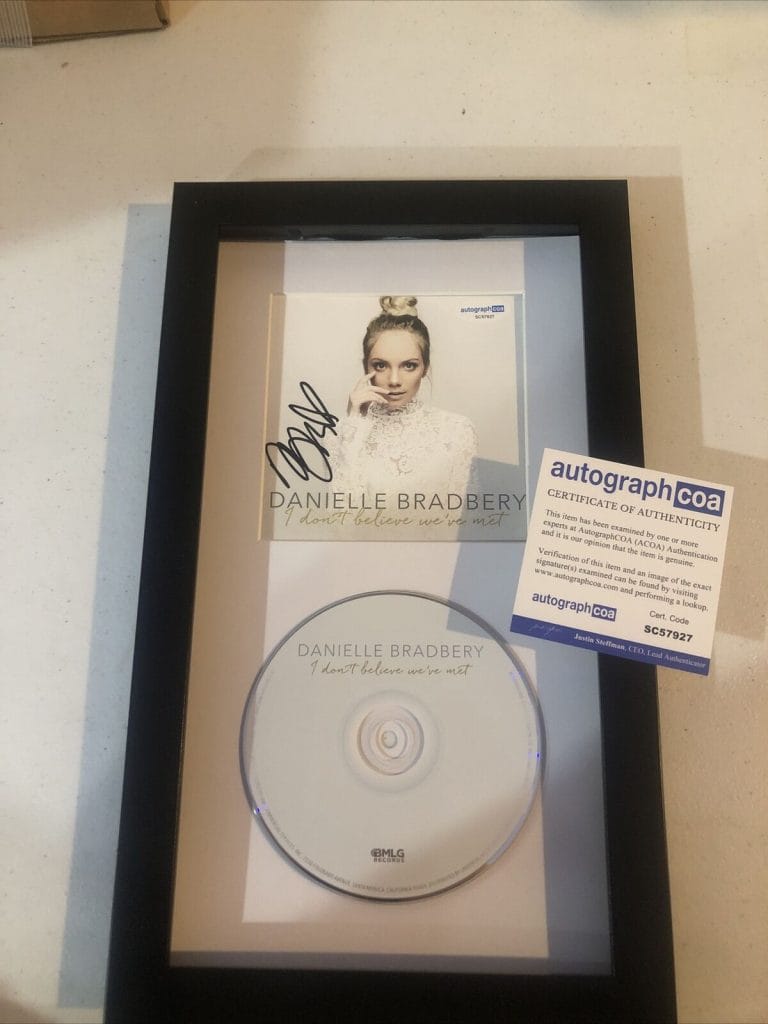 DANIELLE BRADBERY SIGNED AUTOGRAPH FRAMED CD ACOA I DONT BELIEVE WEVE MET COLLECTIBLE MEMORABILIA