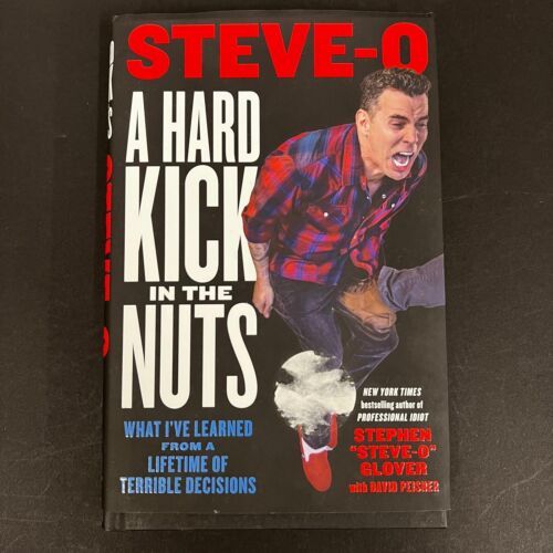STEVE-O SIGNED BOOK PSA/DNA AUTOGRAPHED A HARD KICK IN THE NUTS COLLECTIBLE MEMORABILIA