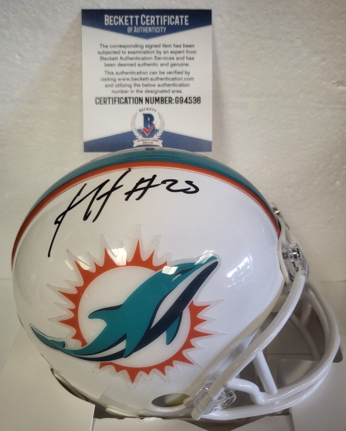 XAVIEN HOWARD MIAMI DOLPHINS SIGNED AUTOGRAPHED MINI HELMET BECKETT #G94536 COLLECTIBLE MEMORABILIA