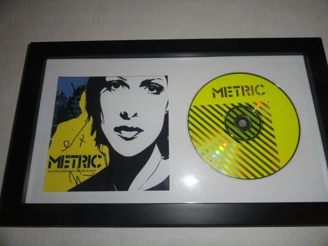 METRIC SIGNED FRAMED 