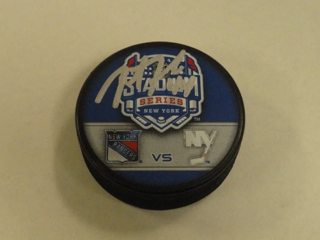 JUSTIN FALK SIGNED 2014 STADIUM SERIES RANGERS VS. ISLANDERS DUELING PUCK