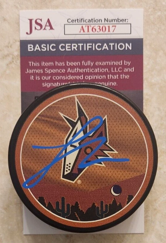 Logan Cooley Signed Reverse Retro Puck w/ JSA COA #AT63017 Arizona Coyotes