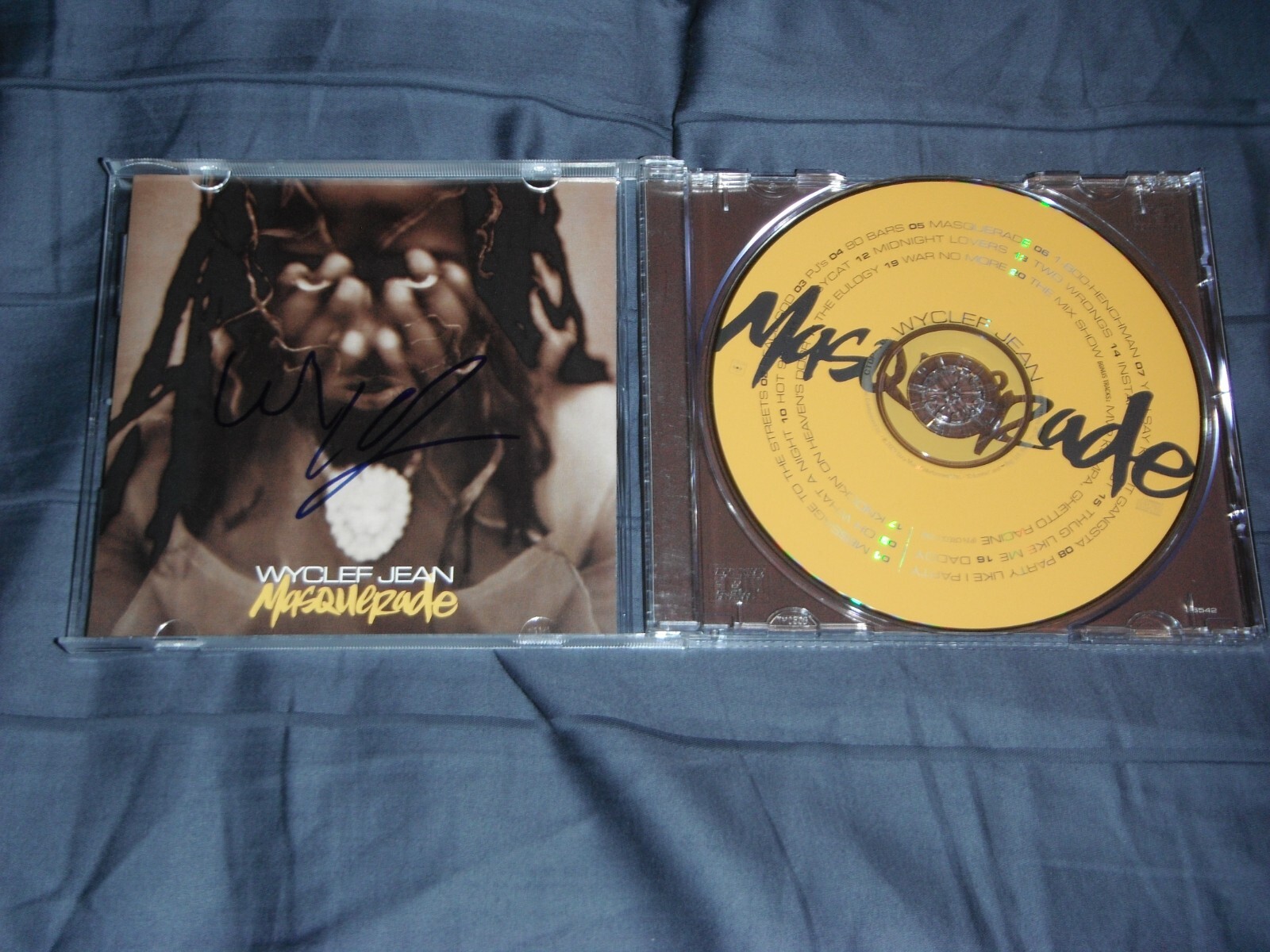 WYCLEF JEAN SIGNED MASQUERADE CD COVER
