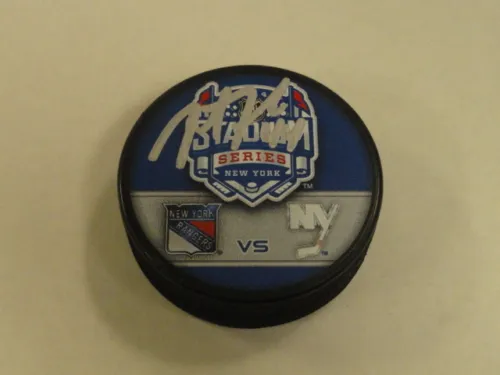 JUSTIN FALK SIGNED 2014 STADIUM SERIES RANGERS VS. ISLANDERS DUELING PUCK