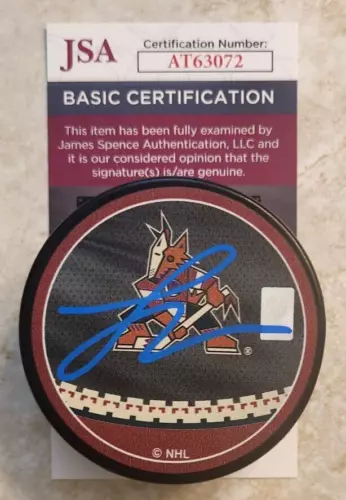 Logan Cooley Signed Reverse Retro Puck w/ JSA COA #AT63072 Arizona Coyotes