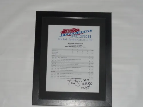 PHIL SIMMS SIGNED FRAMED AND MATTED SUPER BOWL XXI BOX SCORE MVP PROOF