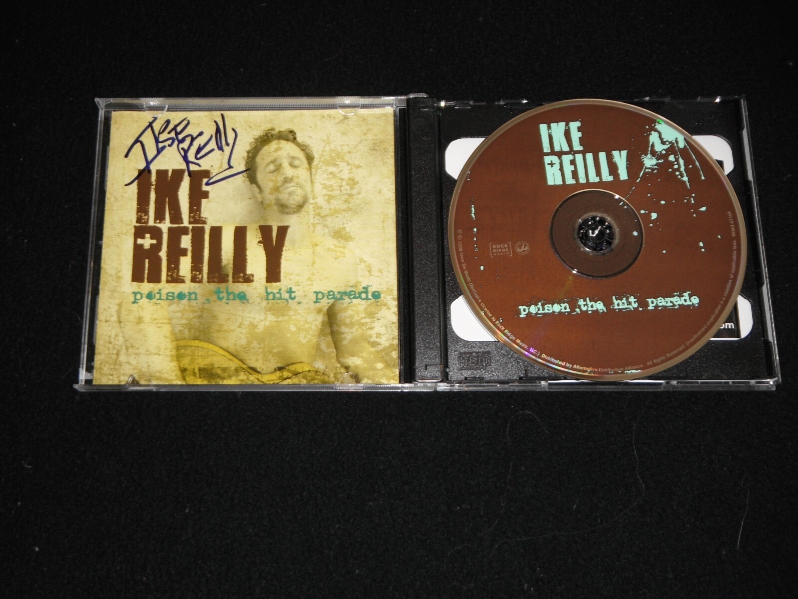 IKE REILLY SIGNED POSION THE HIT PARADE CD COVER