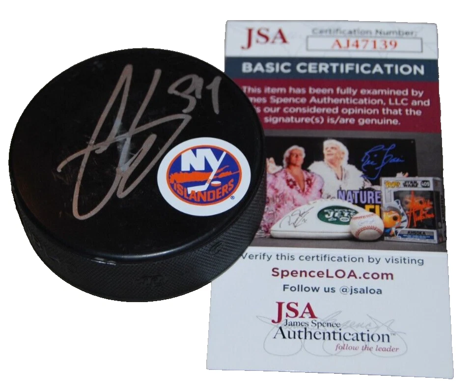 COLE EISERMAN signed (NEW YORK ISLANDERS) Logo hockey puck JSA COA AJ47139