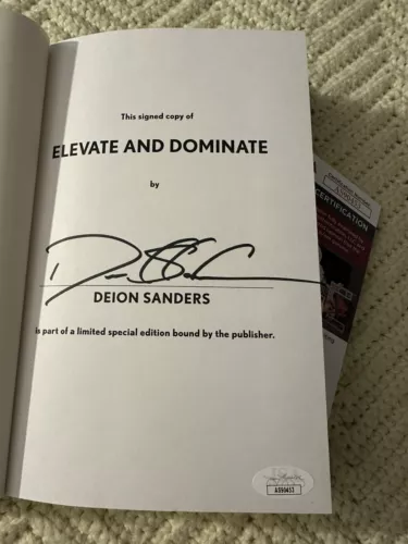 DEION SANDERS SIGNED ELEVATE DOMINATE BOOK HARDCOVER JSA AUTHENTICATED COA 2024 COLLECTIBLE MEMORABILIA