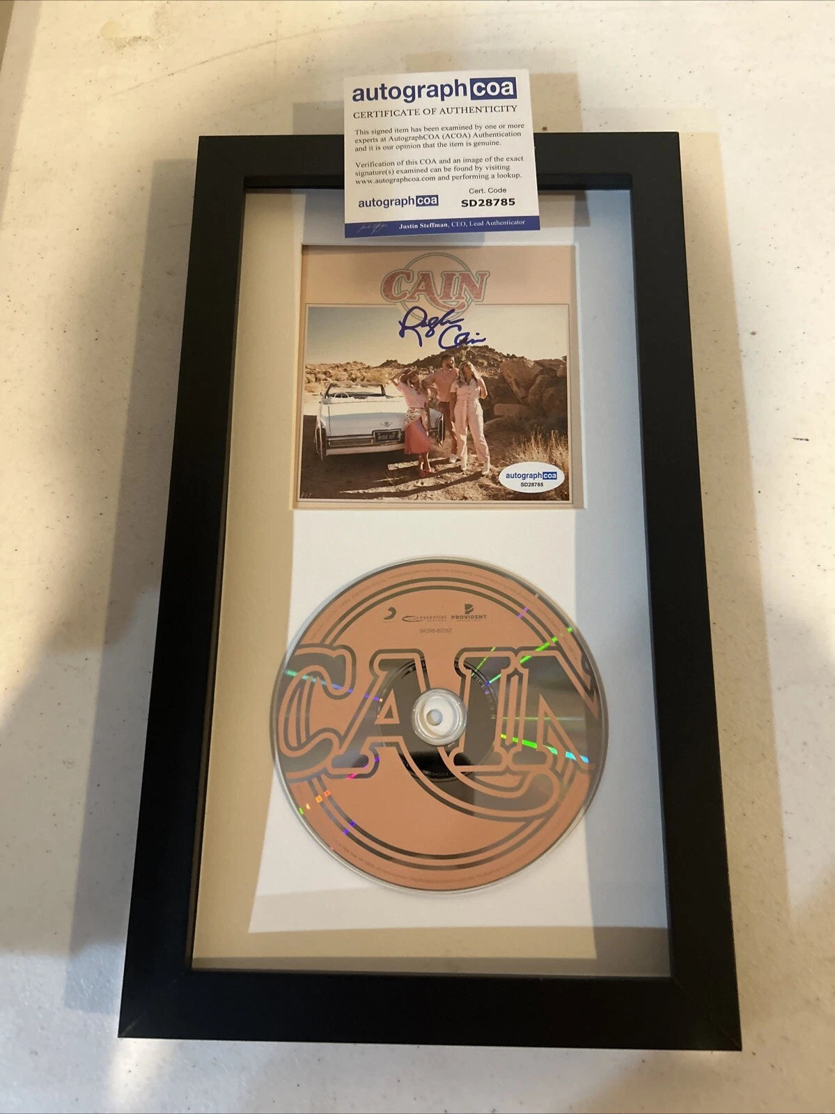 LOGAN CAIN “ CAIN” SIGNED AUTOGRAPH FRAMED CD DISPLAY ACOA RISE UP ALBUM BAND