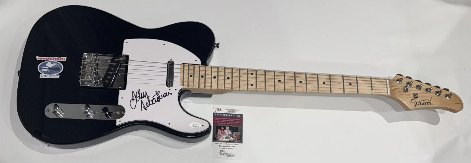 JOHN SEBASTIAN SIGNED BLACK ELECTRIC GUITAR WOODSTOCK LEGEND JSA COA