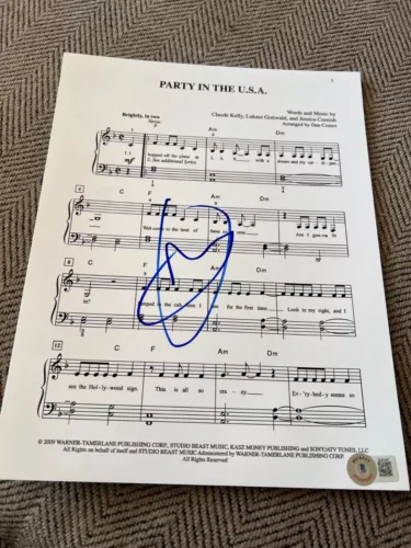 MILEY CYRUS SIGNED SHEET MUSIC MIDNIGHT SKY PARTY IN THE USA BECKETT BAS COA F