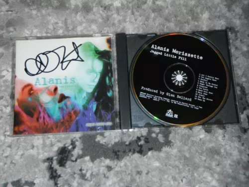 ALANIS MORISSETTE SIGNED JAGGED LITTLE PILL CD COVER COLLECTIBLE MEMORABILIA