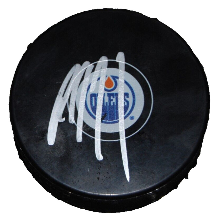 PAUL COFFEY signed (EDMONTON OILERS) hockey puck BECKETT BAS BR67707