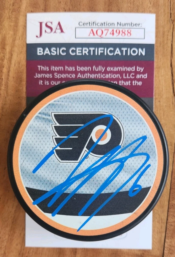 Travis Sanheim Signed Reverse Retro Puck w/ JSA COA #AQ74988 Philadelphia Flyers