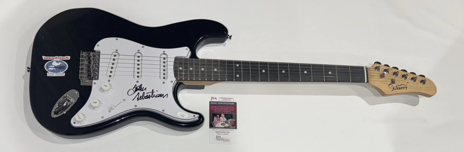JOHN SEBASTIAN SIGNED BLACK ELECTRIC GUITAR WOODSTOCK LEGEND JSA COA