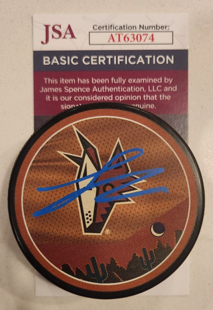 Logan Cooley Signed Reverse Retro Puck w/ JSA COA #AT63074 Arizona Coyotes