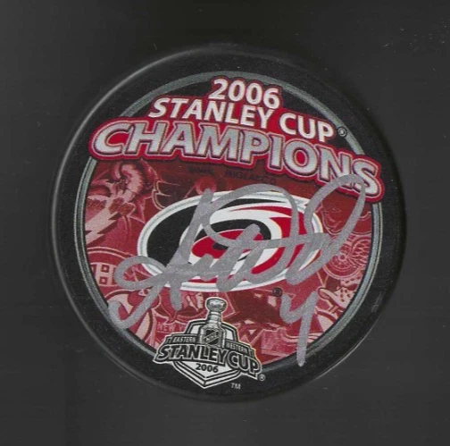 AARON WARD SIGNED CAROLINA HURRICANES 2006 STANLEY CUP CHAMPIONS PUCK COLLECTIBLE MEMORABILIA