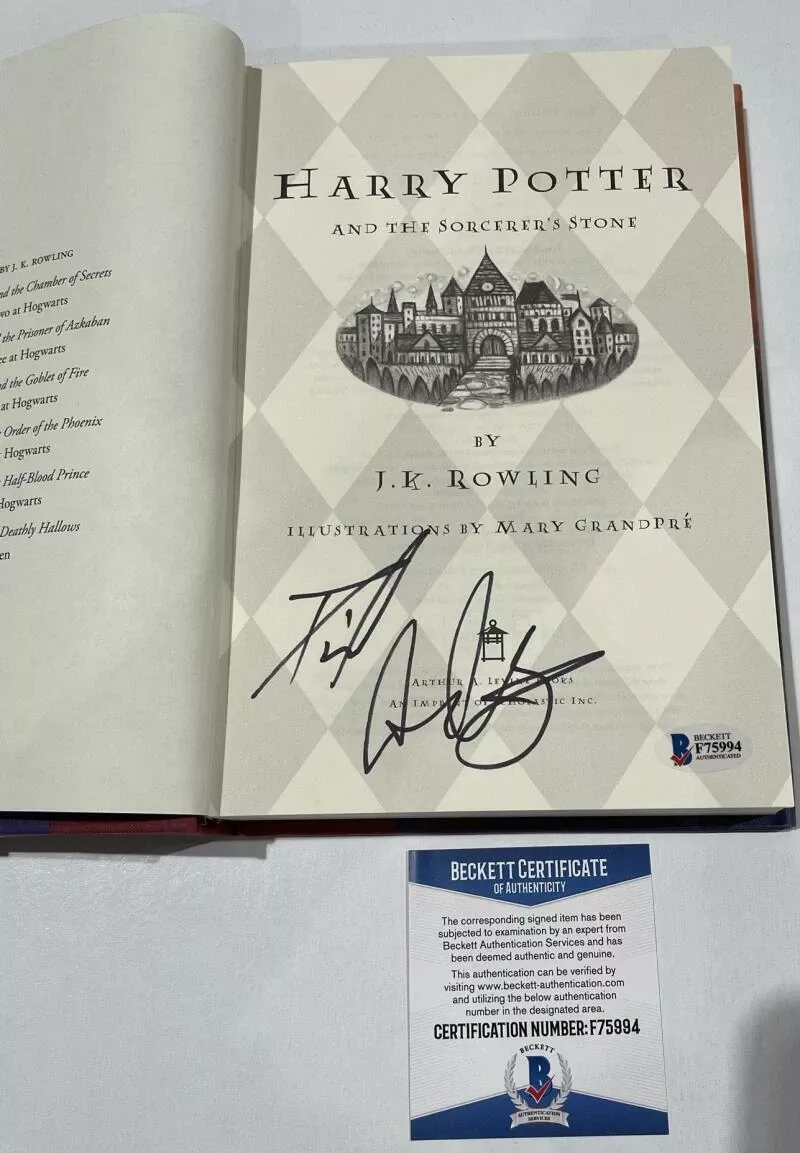 DANIEL RADCLIFFE SIGNED HARRY POTTER AND THE SORCERER'S STONE BOOK BECKETT 129