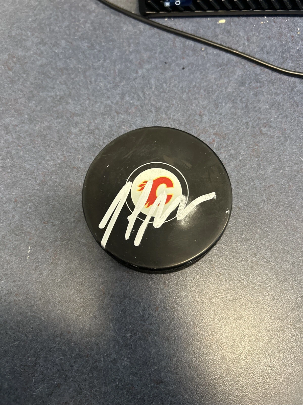 CALGARY FLAMES- JOEL BOUCHARD SIGNED AUTOGRAPH LOGO HOCKEY PUCK ACOA