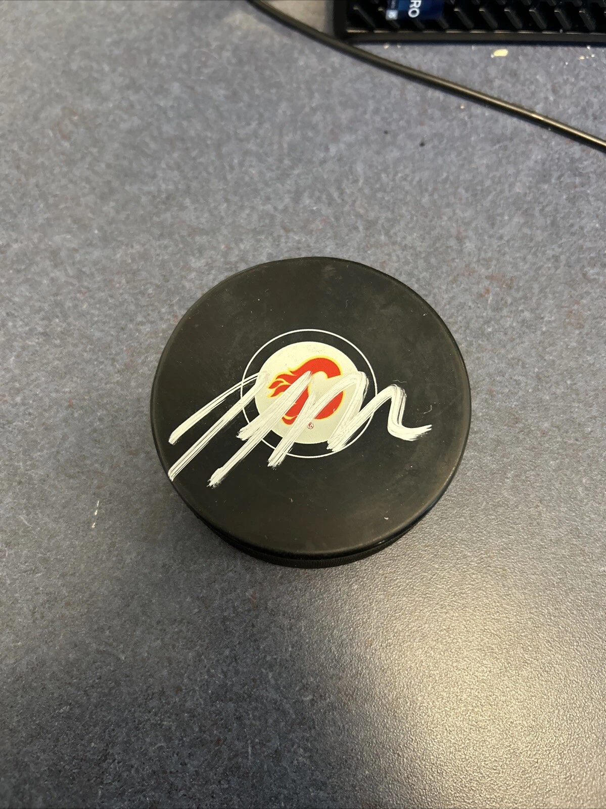 CALGARY FLAMES- JOEL BOUCHARD SIGNED AUTOGRAPH LOGO HOCKEY PUCK ACOA