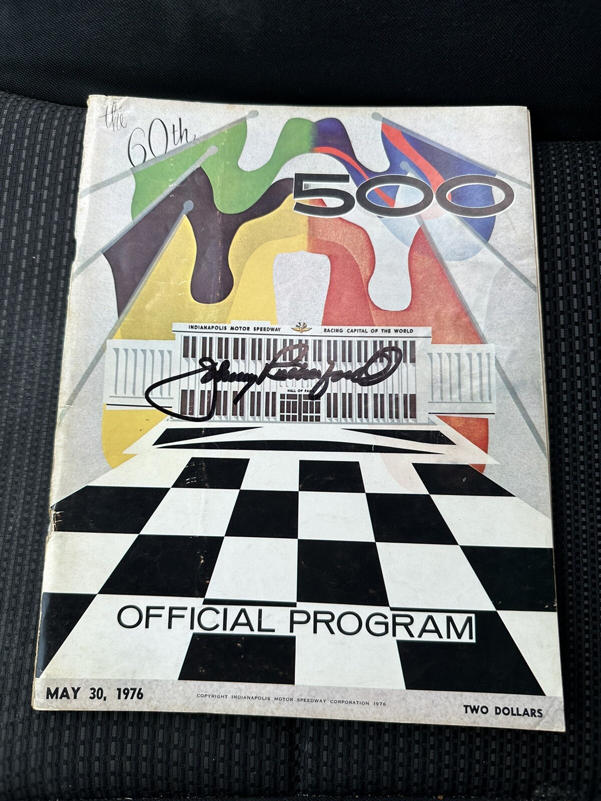 1976 INDY 500 PROGRAM SIGNED BY WINNER JOHNNY RUTHERFORD AUTOGRAPHED COLLECTIBLE MEMORABILIA