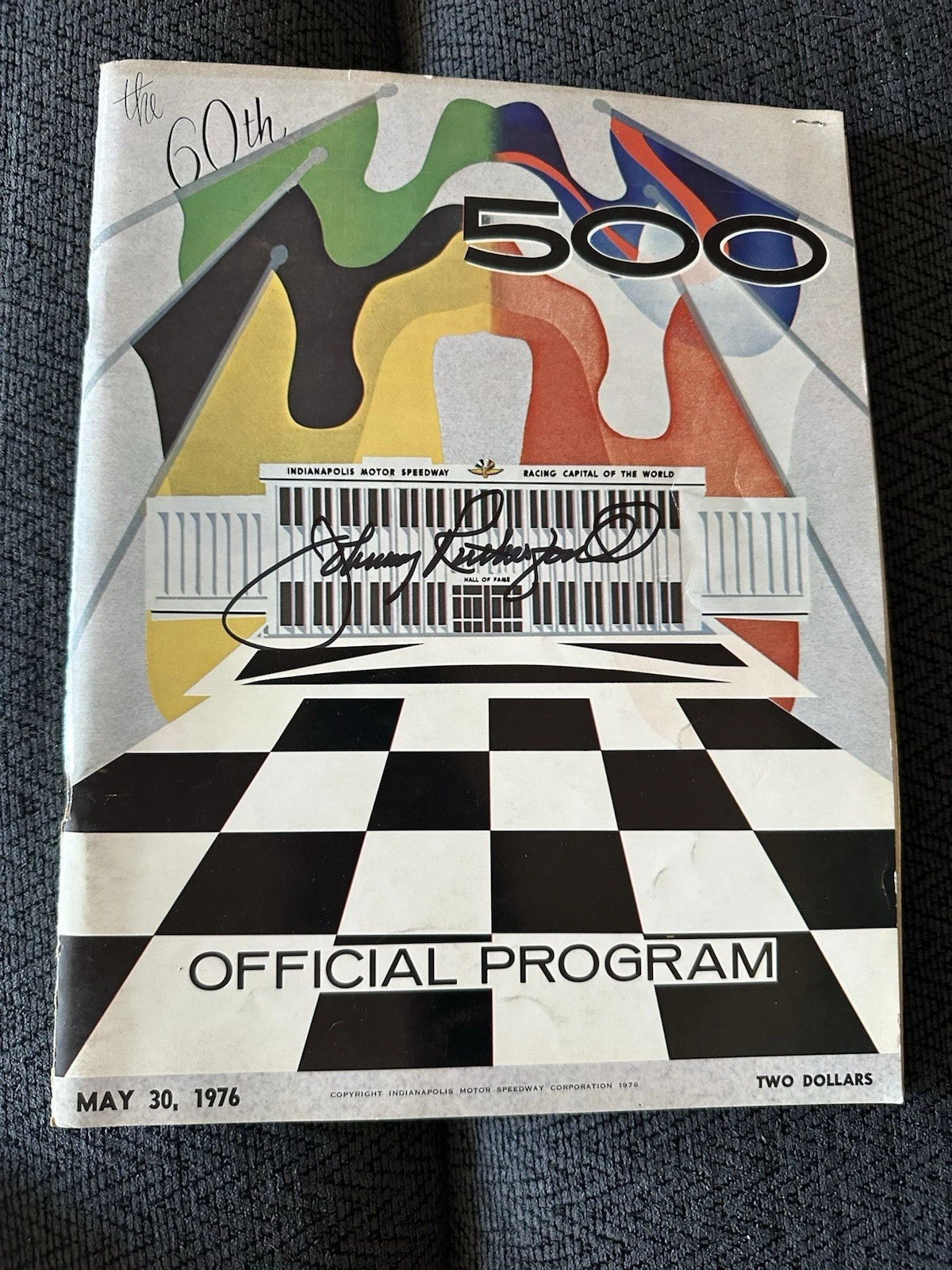 1976 INDY 500 PROGRAM SIGNED BY WINNER JOHNNY RUTHERFORD AUTOGRAPHED COLLECTIBLE MEMORABILIA