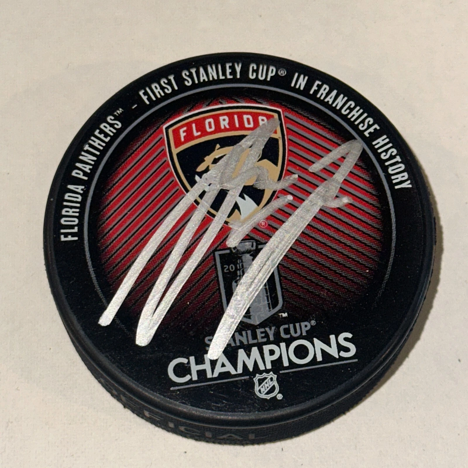 ANTON LUNDELL Signed PANTHERS 2024 STANLEY CUP CHAMPS Puck Beckett (BAS)