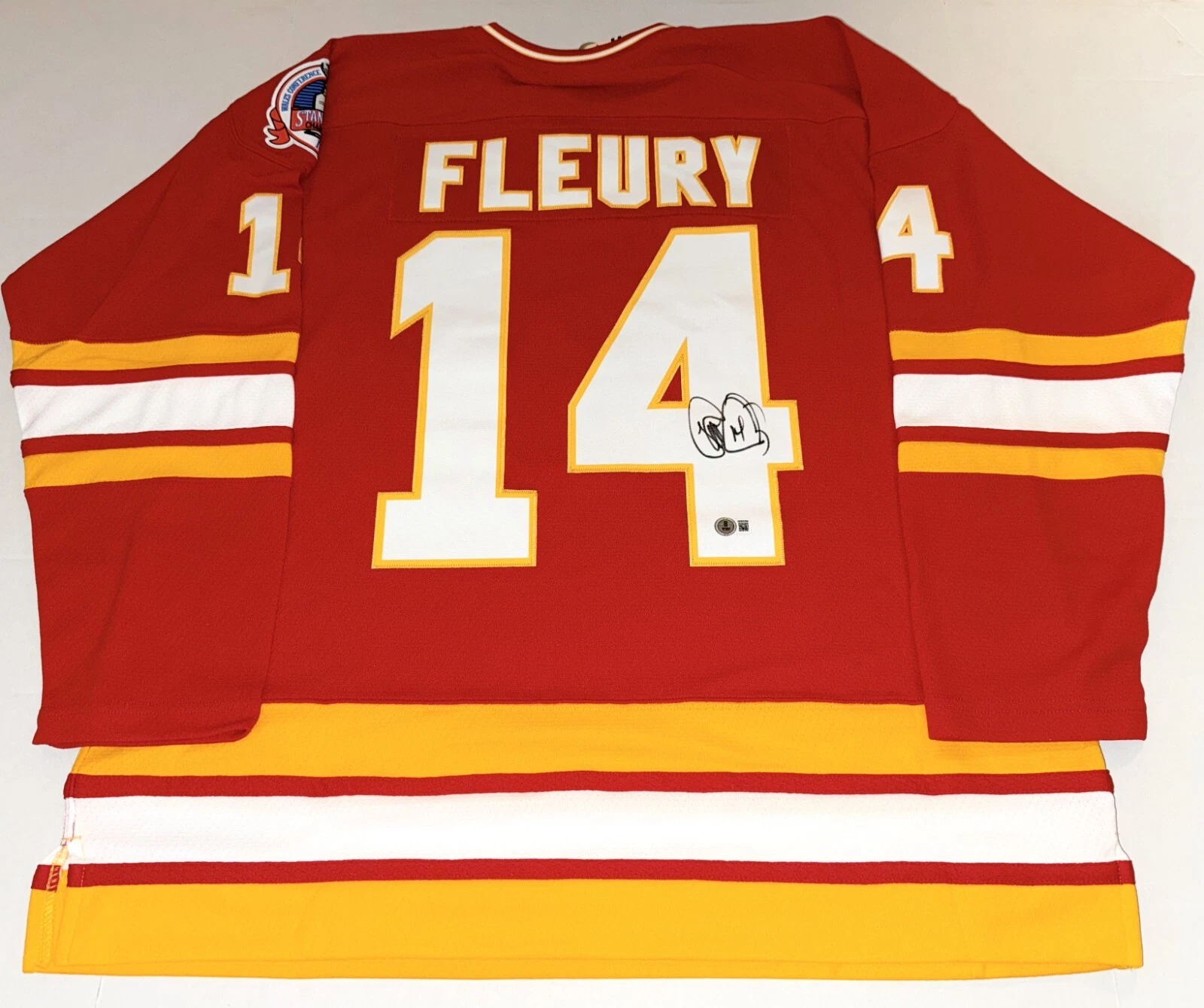 Theo Fleury signed Mitchell & Ness Calgary Flames jersey Beckett Witnessed