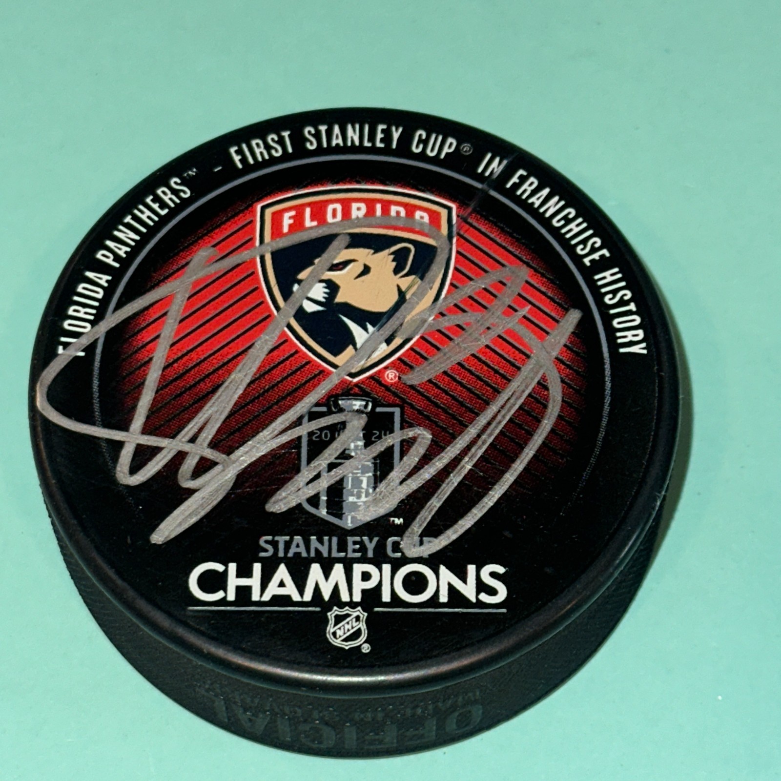 KEVIN STENLUND (Panthers) Signed 2024 STANLEY CUP CHAMPS Puck Beckett (BAS)