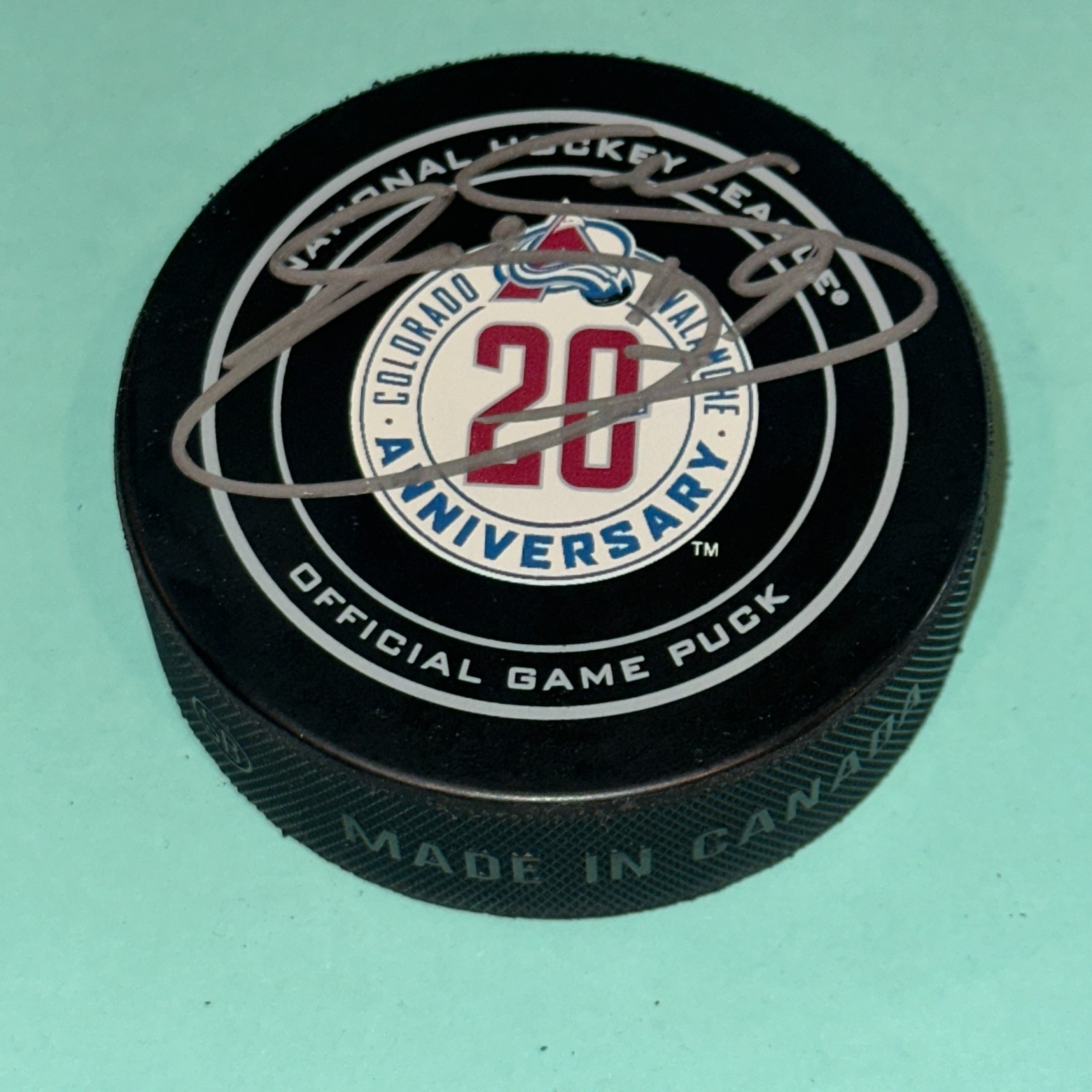 JOE SAKIC Signed Colorado AVALANCHE 20th Official GAME Puck Beckett Auth. (BAS)