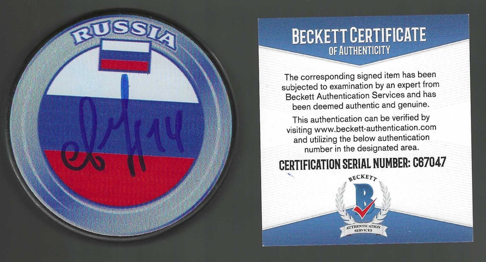 Andrei Svechnikov Signed Russia Hockey Puck Signed in Russian Beckett Hurricanes