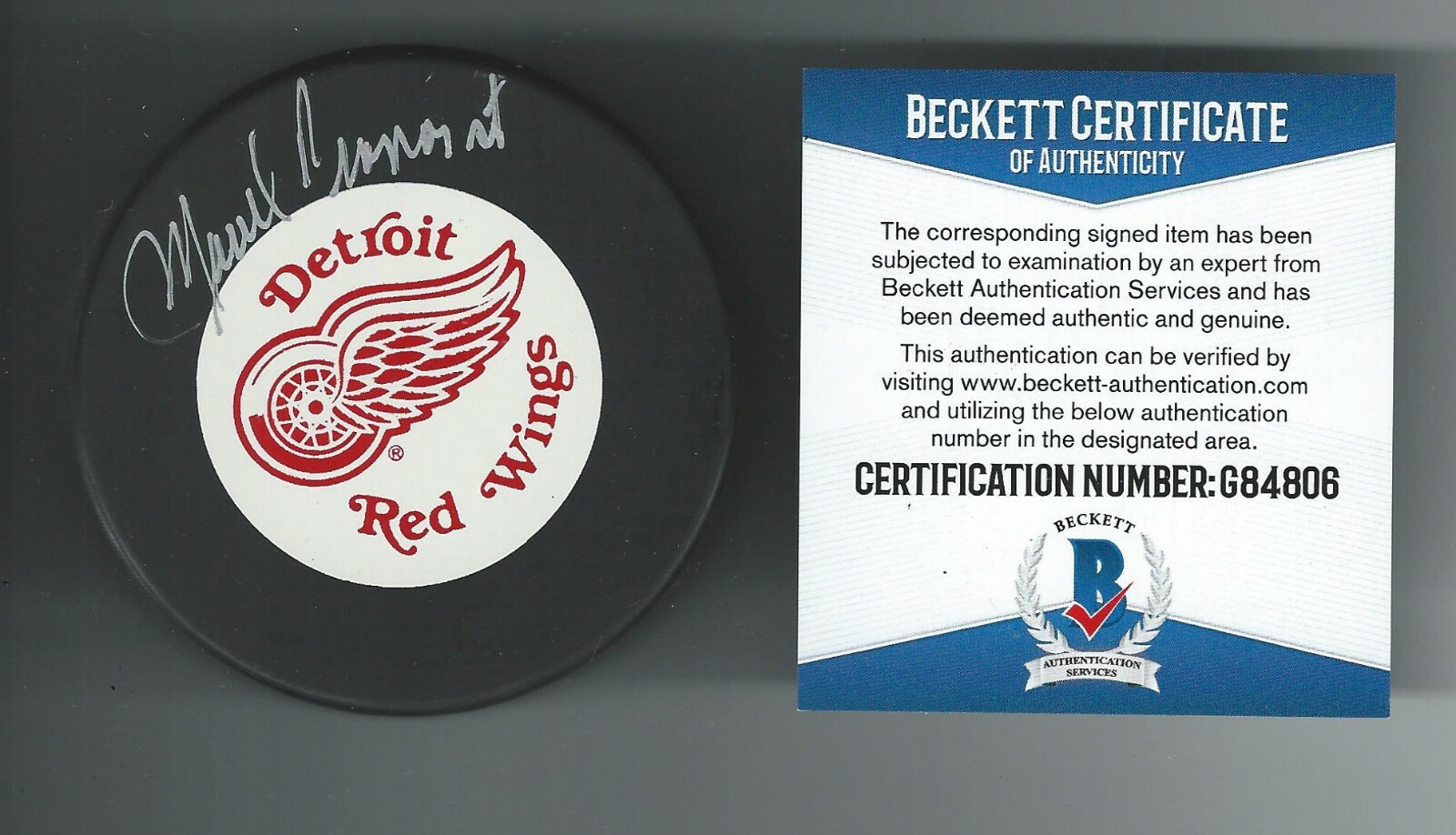 Macrel Pronovost Signed Detroit Red Wings Trench Puck Beckett COA