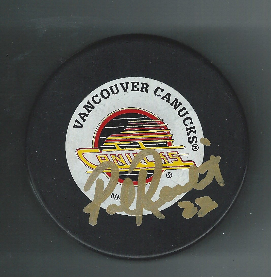 Paul Reinhart Signed Vancouver Canucks Trench Puck